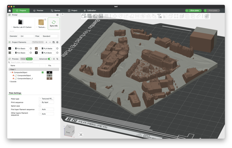 A screen shot of a 3D printer tool, showing a rendering of a model of a section of a city with the ground level, showing faint impressions of roads, in one colour, and then all the buildings in another. The area is St George's Hall and Liverpool Central Library.