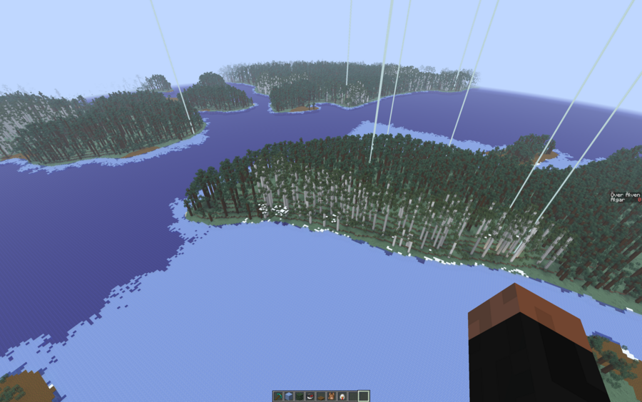 A screenshot in minecraft taken looking down at a mixture of forest and river, with a mix of pine and birch trees, and the river is partially frozen.